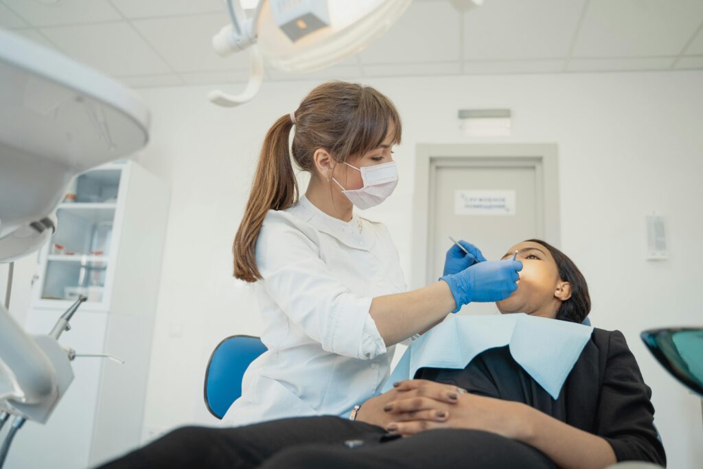 A Doctor examines a patient in Dental hospitals in kphb